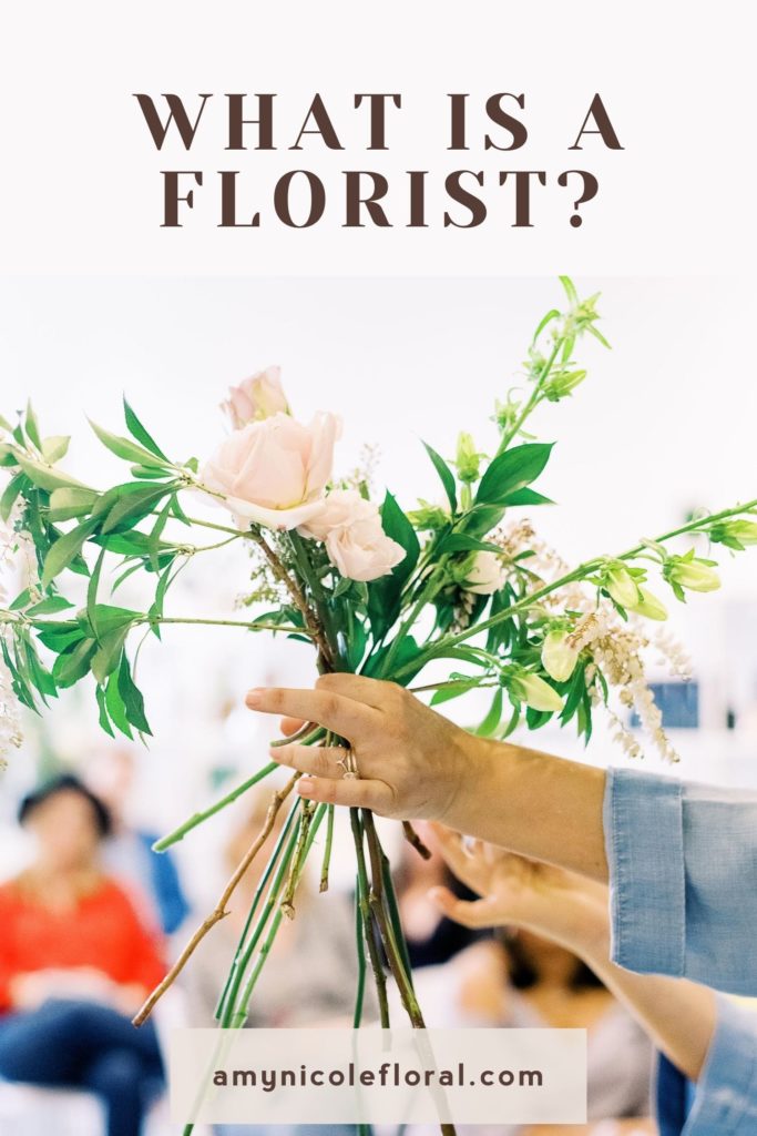 Amy from Amy Nicole Floral holds a small bouquet of flowers in front of her for her students to see as an example of what florists do when answering the question: What is a Florist? Image overlaid with text that reads "What Is A Florist?"