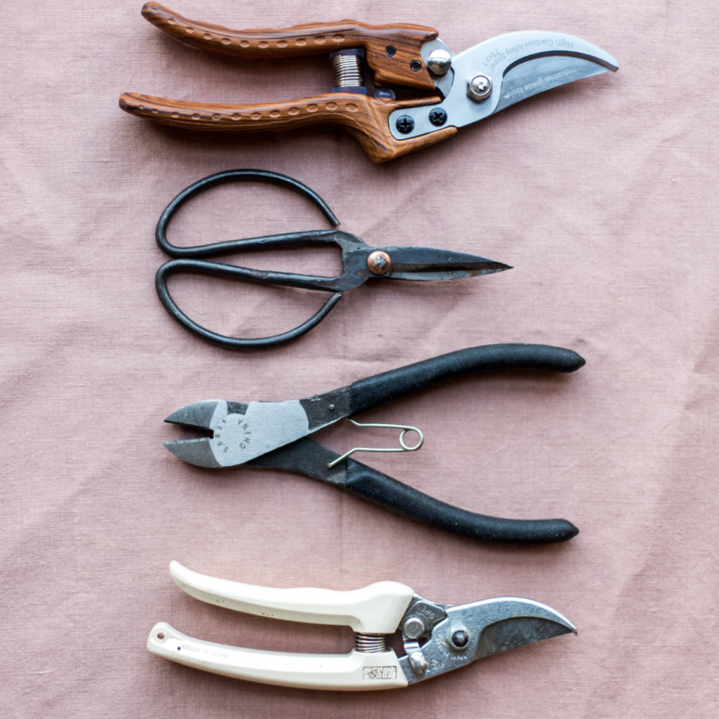Image of 4 different florist knives and cutting tools from The Florist Coach's favorite tools