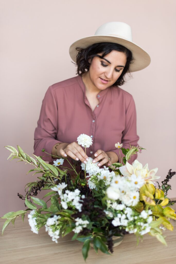 Amy Balsters, The Floral Coach® is preparing an arrangement