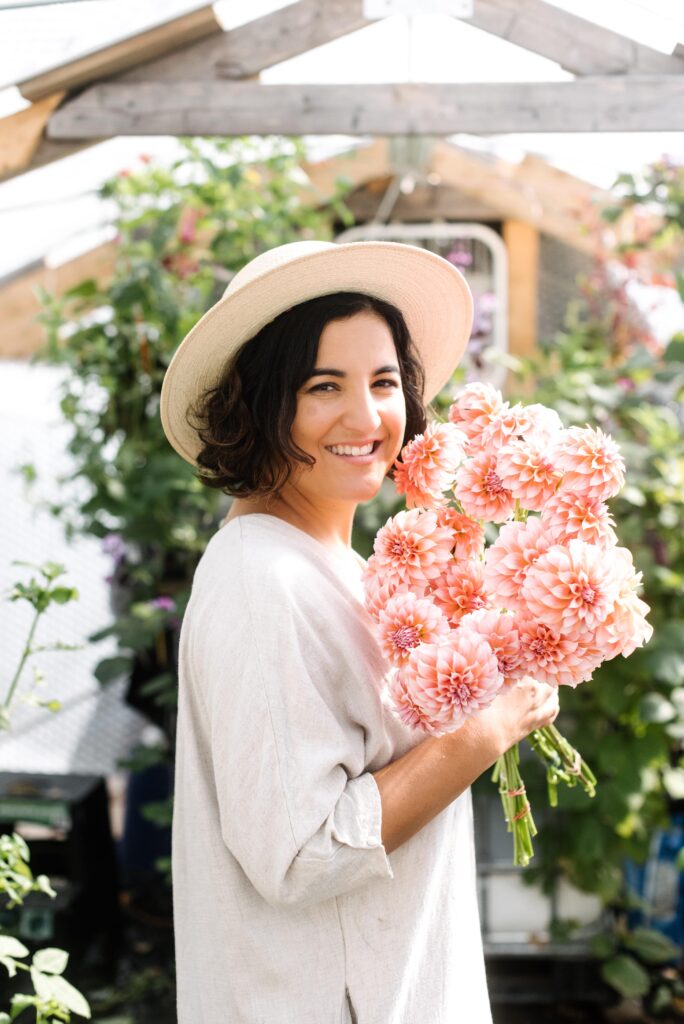 Amy Balsters, The Floral Coach® holds a bundle of blooms
